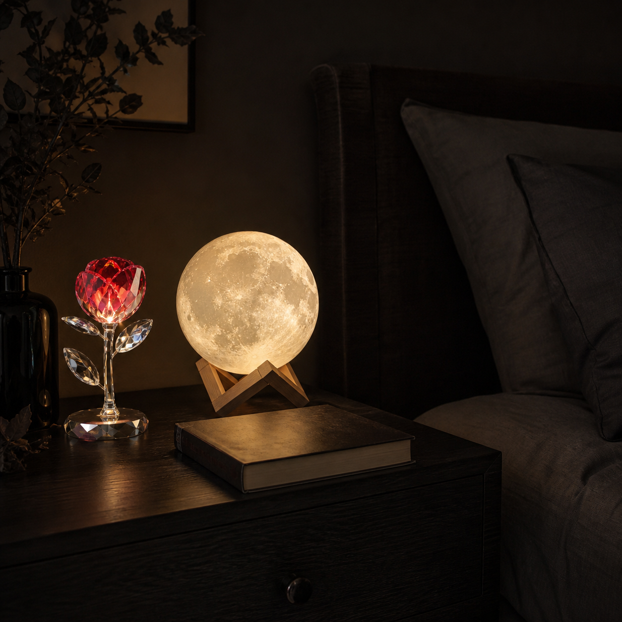 Dark bedroom nightstand with glowing moon lamp and crystal rose light